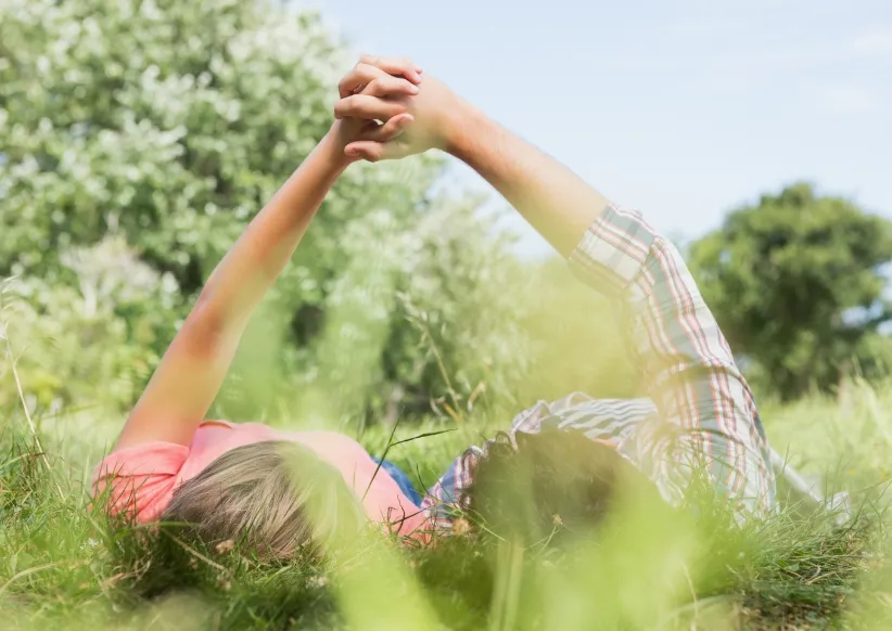 cute couple holding hands in the park on a sunny d utc