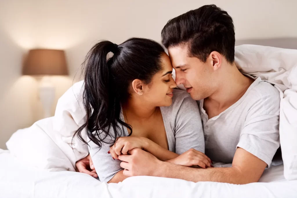 loving-couple-embrace-underneath-soft-bedding-at-h-2026-01-09-09-18-26-utc